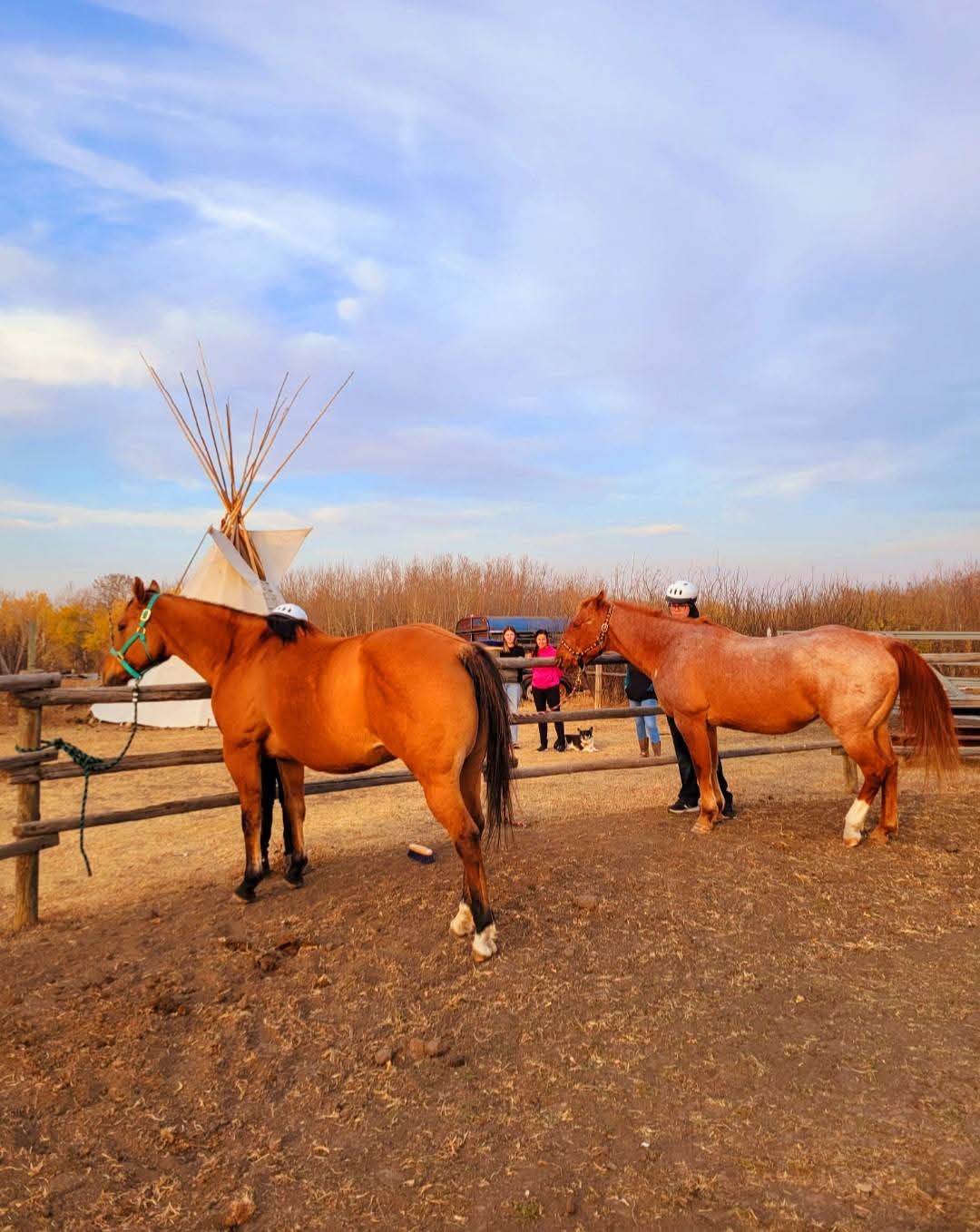Horses and riders near the tipi at Spiritstone.